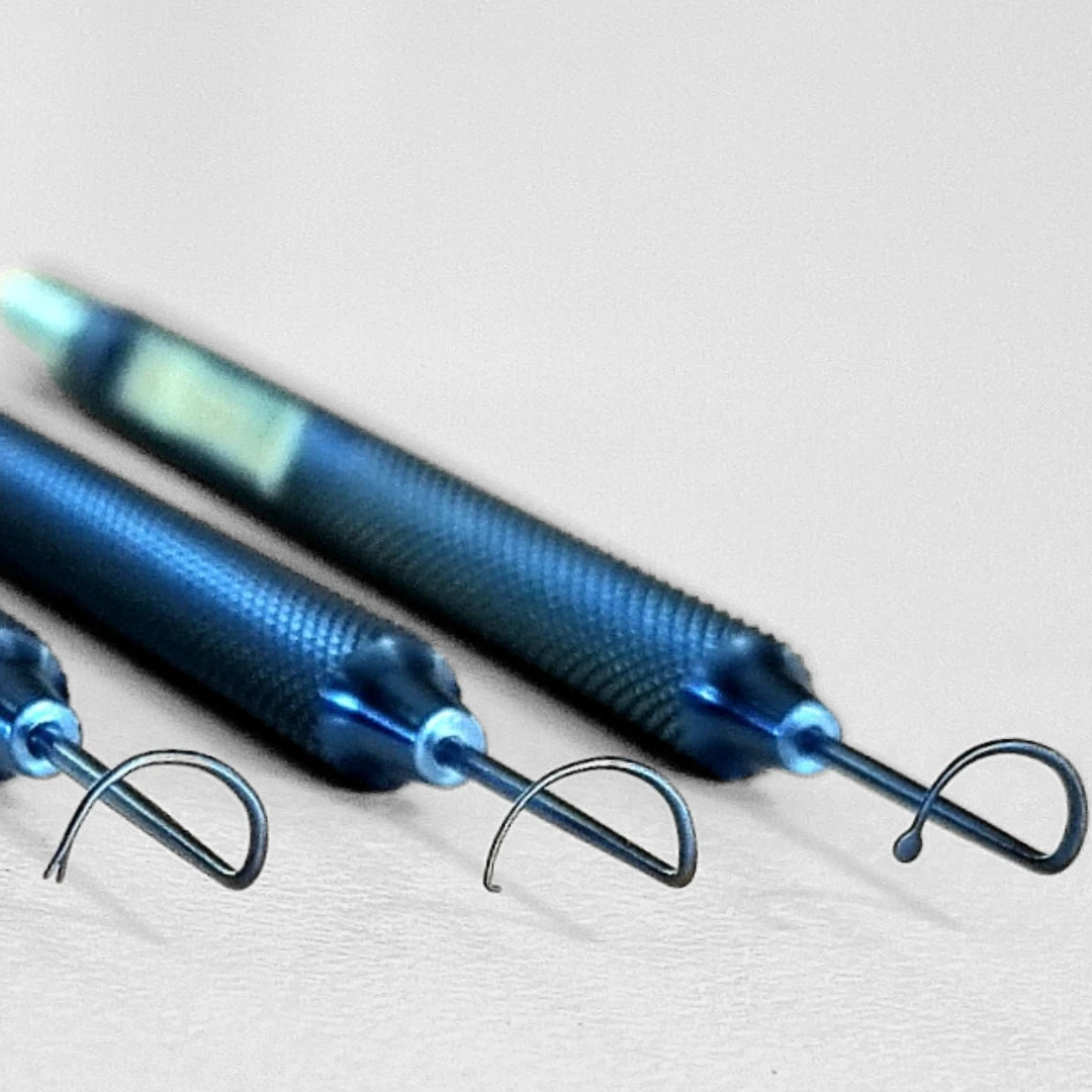 Blue titanium Cronin–Gunn CAIRS instruments with curved separator, pusher and puller tips, photographed by SRB Devices.