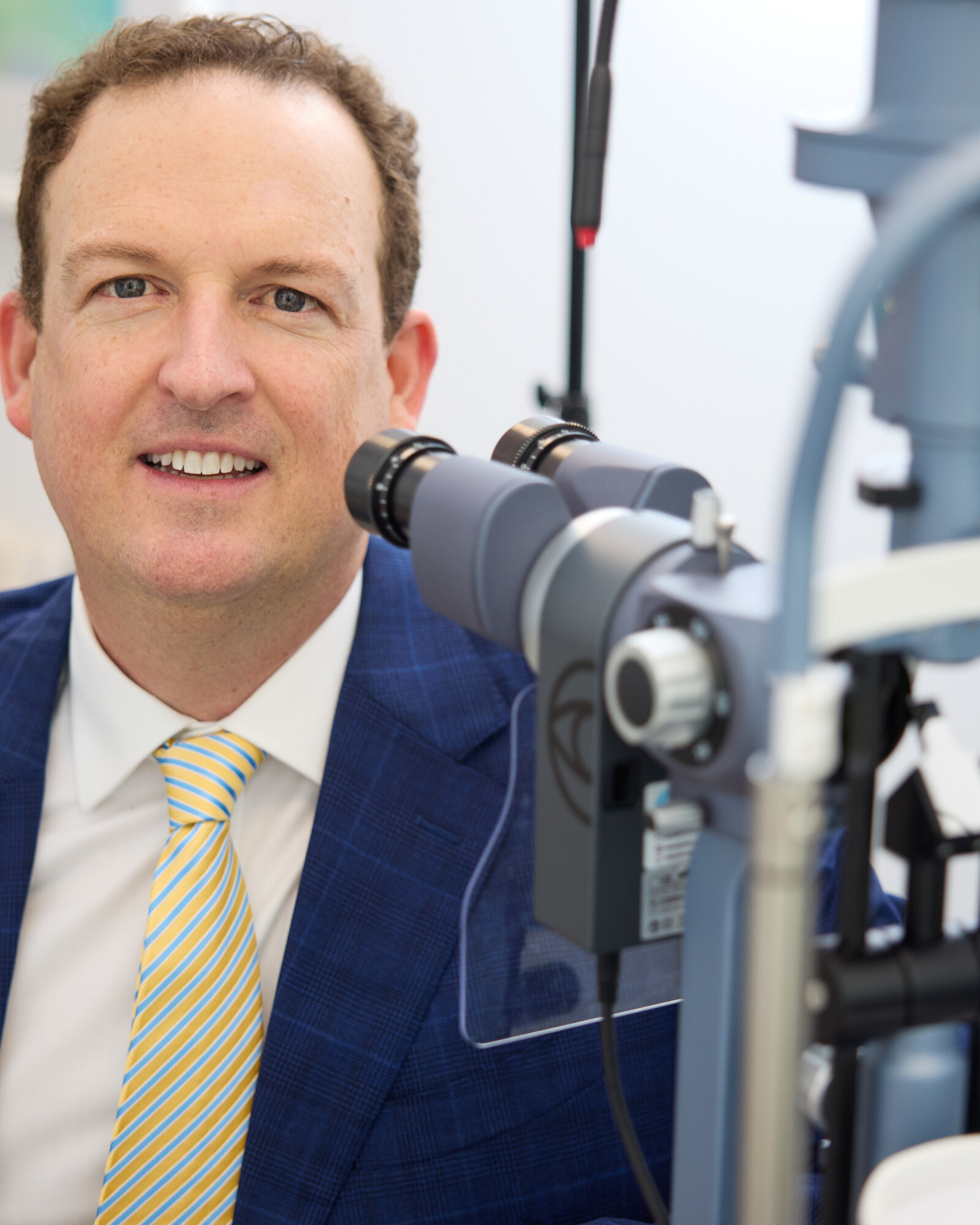 Dr Brendan Cronin at the slit lamp at QEI